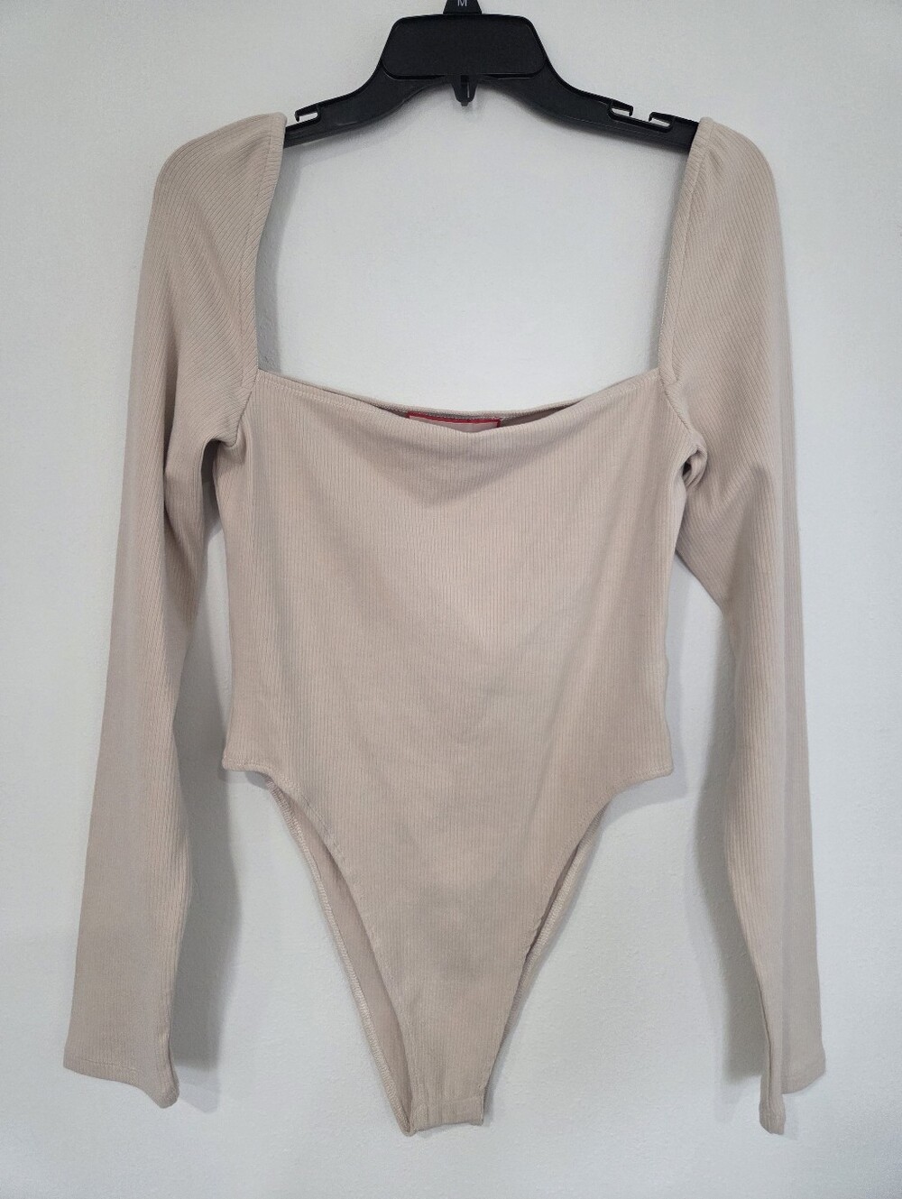 Atoir Neutral Ribbed Long Sleeve One-Piece Bodysuit in Beige